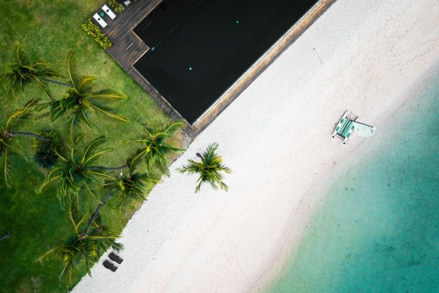 Arial image of beach and resort gardens and deck